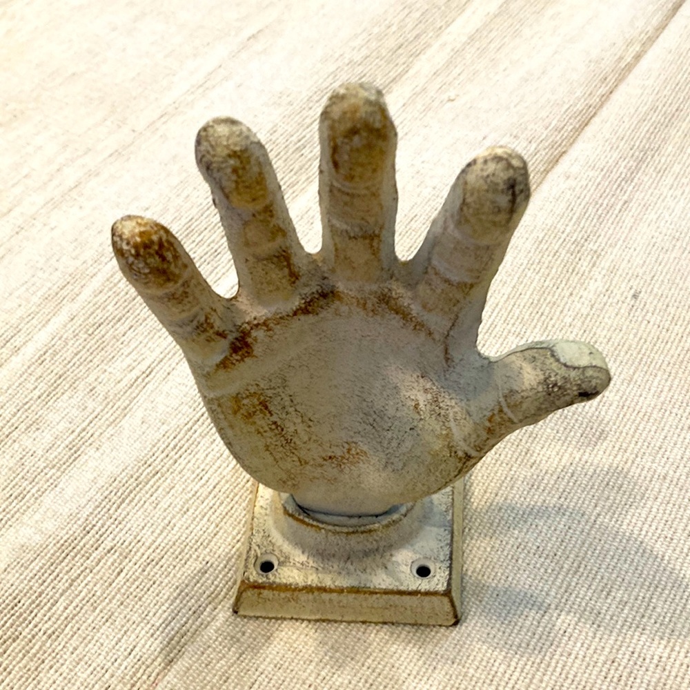 Vintage cast-iron hand and hanger
